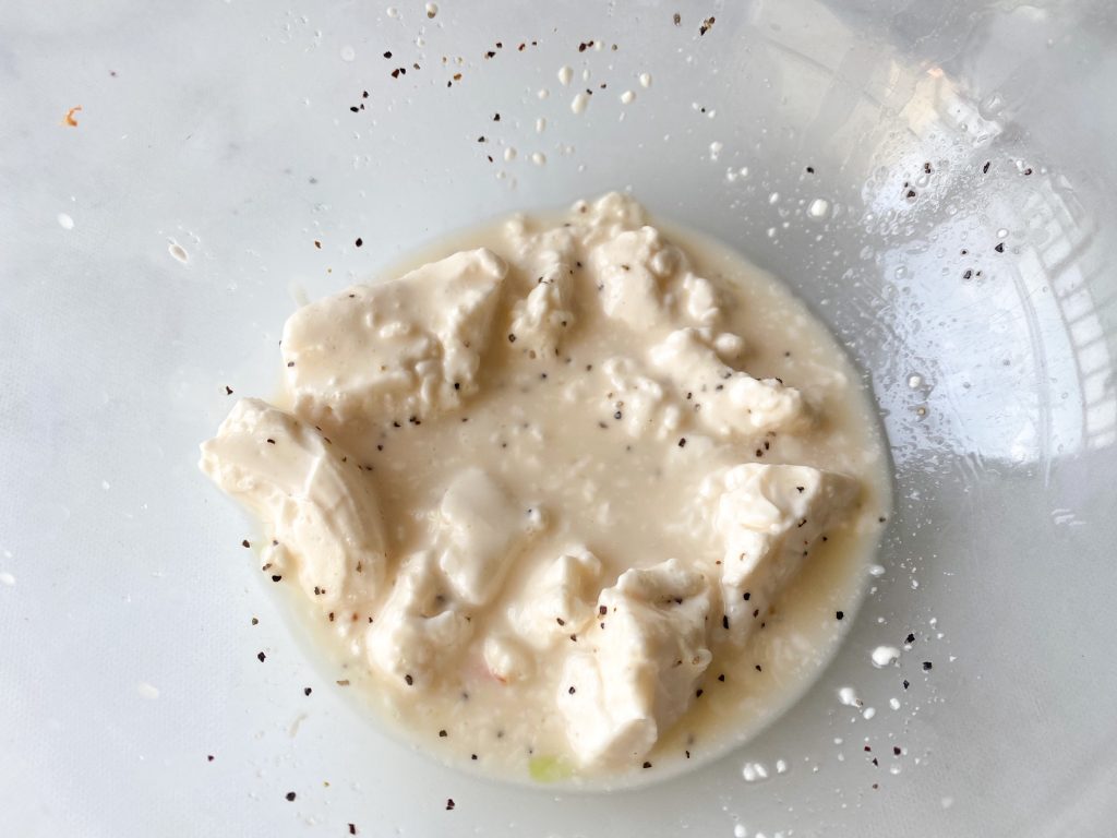 vegan coleslaw dressing in a clear bowl