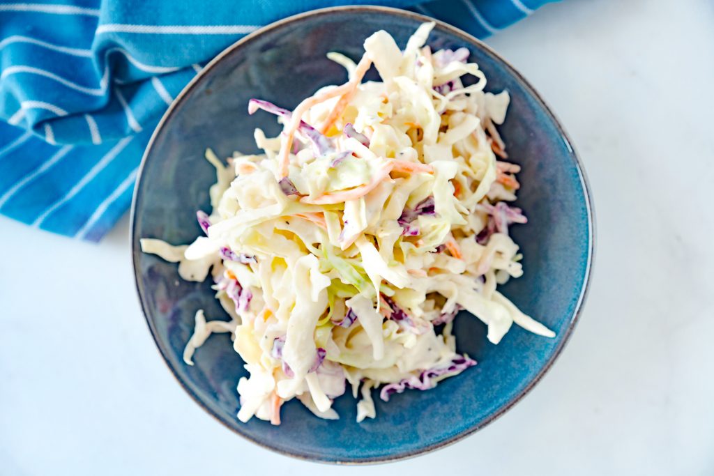 vegan coleslaw dressing in a blue bowl