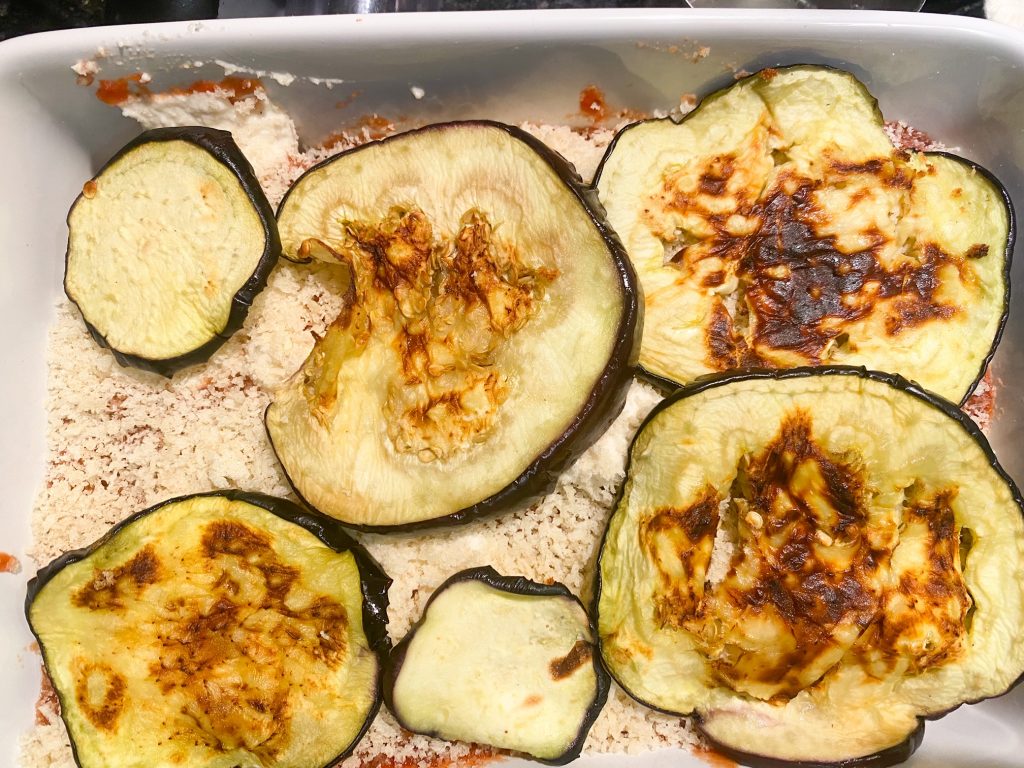 assembling vegan eggplant parmesan