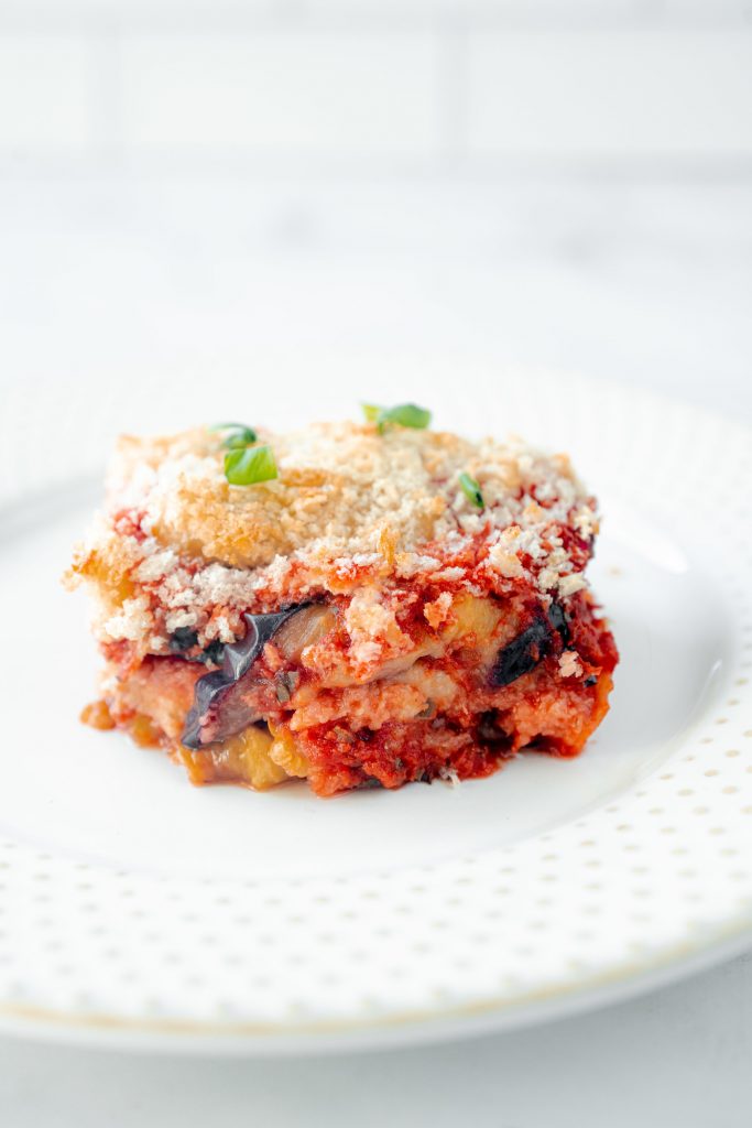 up close image of a slice of vegan eggplant parmesan