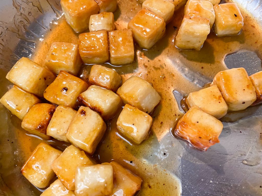 vegan orange tofu tossed in orange sauce