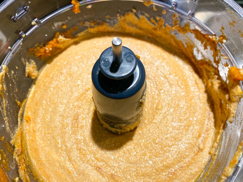 puree mixture that is orange and blended up in a food processor