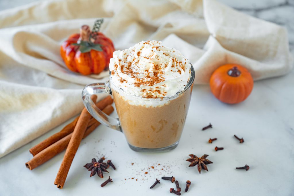 vegan pumpkin spice latte with whipped cream and cinnamon sprinkles