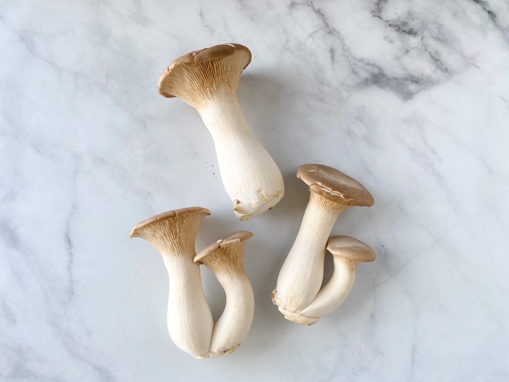 king oyster mushrooms on table for size