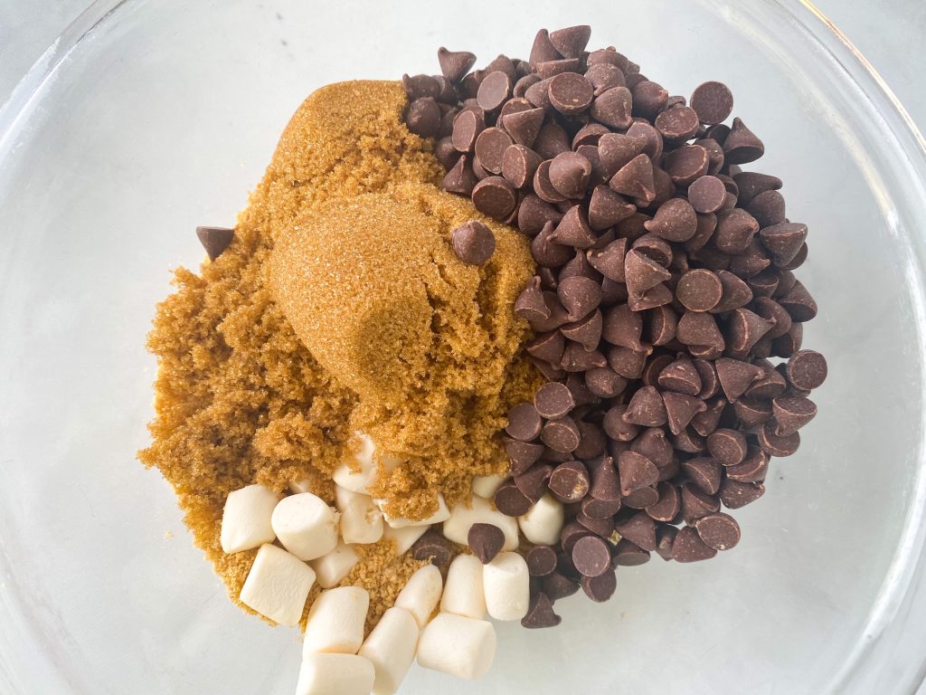 ingredients in a bowl for vegan smores cookie bars