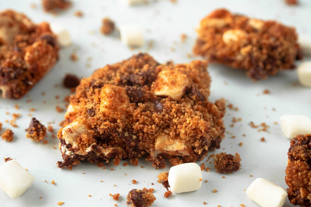 mini marshmallows sprinkled about vegan smores bars
