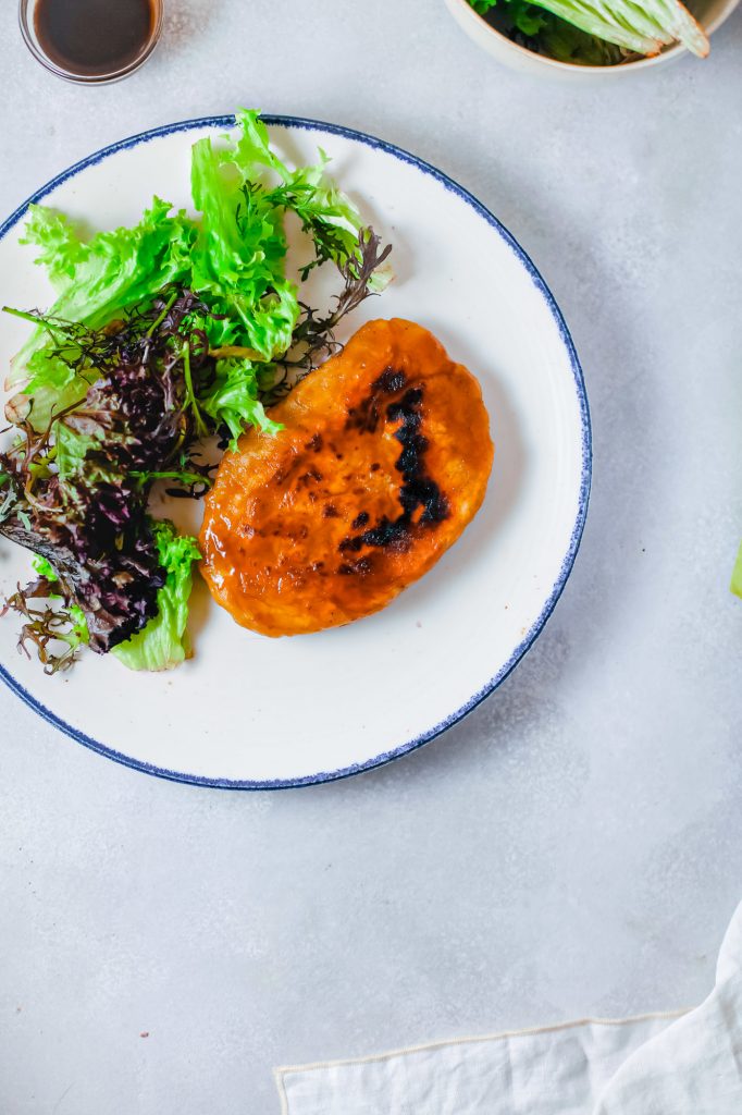 seitan steak with sauce on a plate