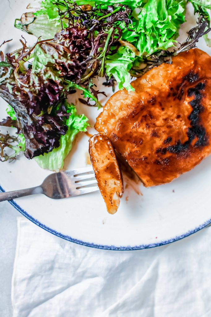 vegan steak cut on a fork with salad