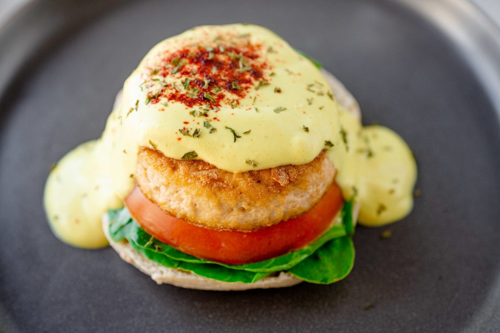 close up image of vegan eggs benedict made from tofu