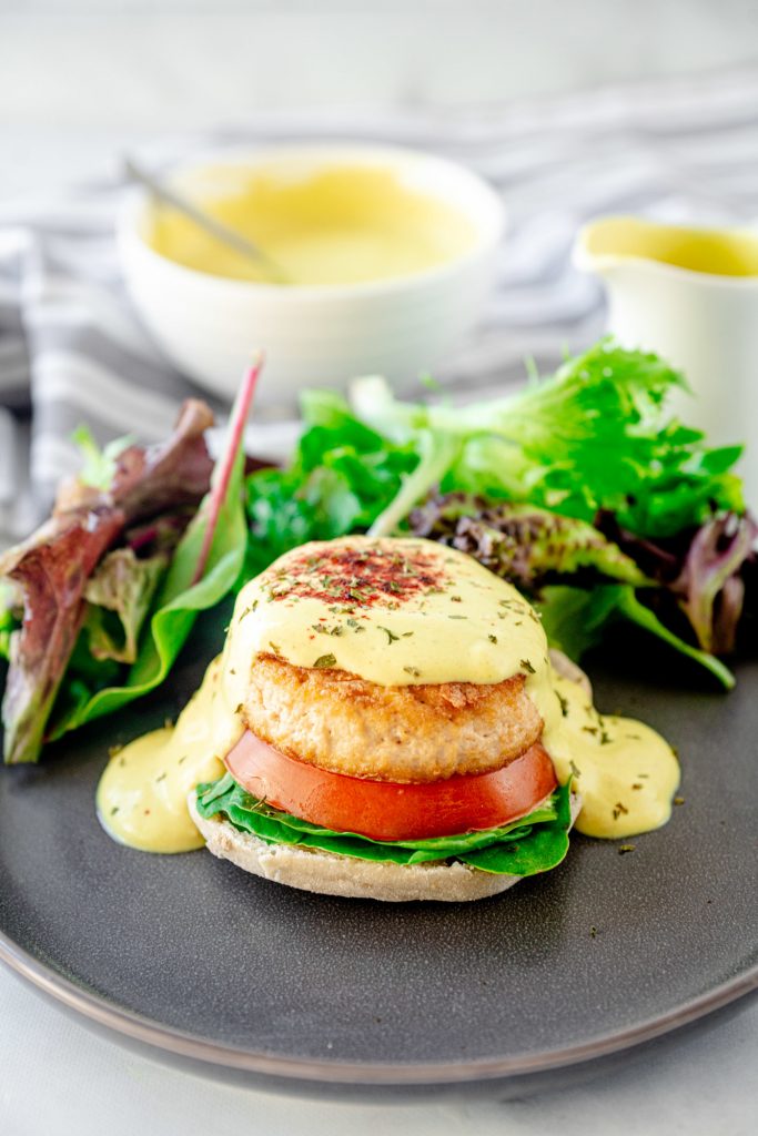 vegan eggs benedict with a salad on a plate