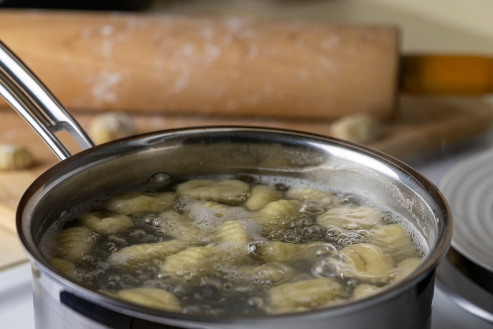 vegan gnocchi boiling in water and cooking