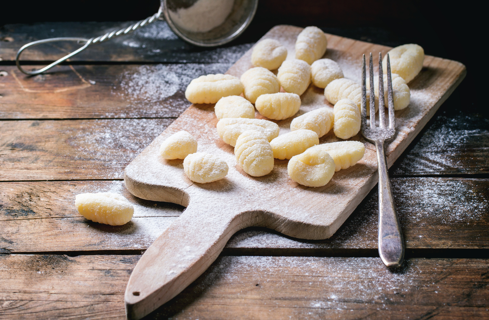 using a fork for shaping the vegan gnocchi pasta