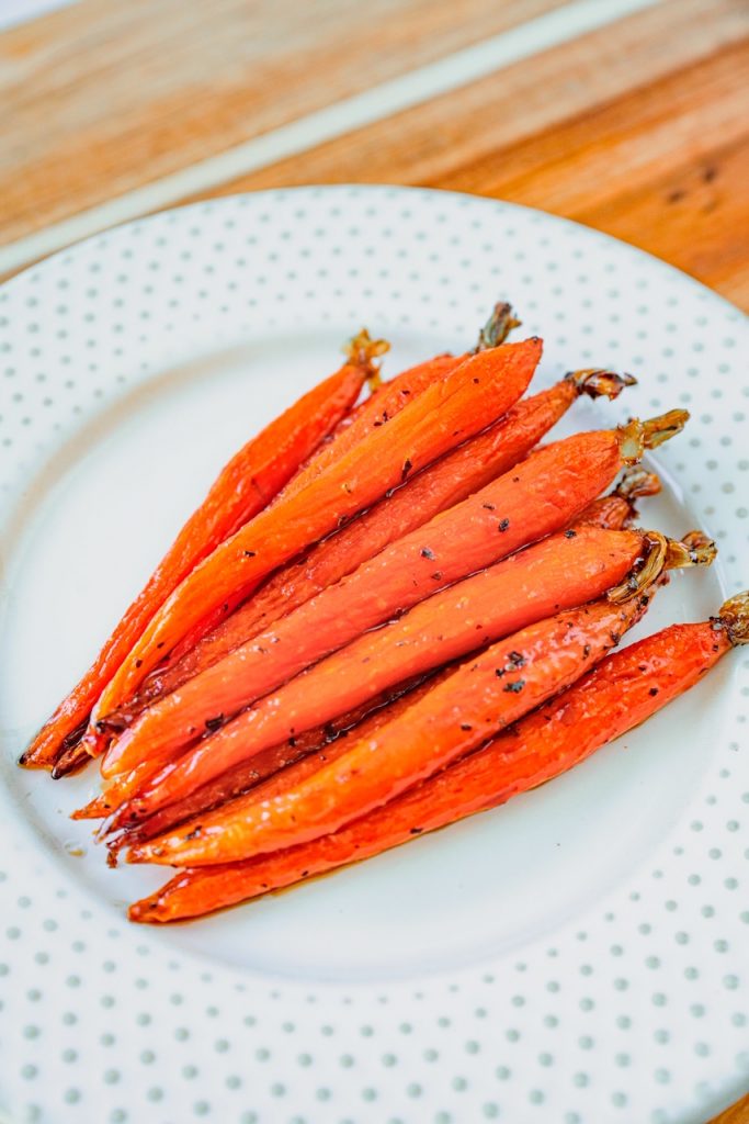 vegan maple glazed carrots on white plate