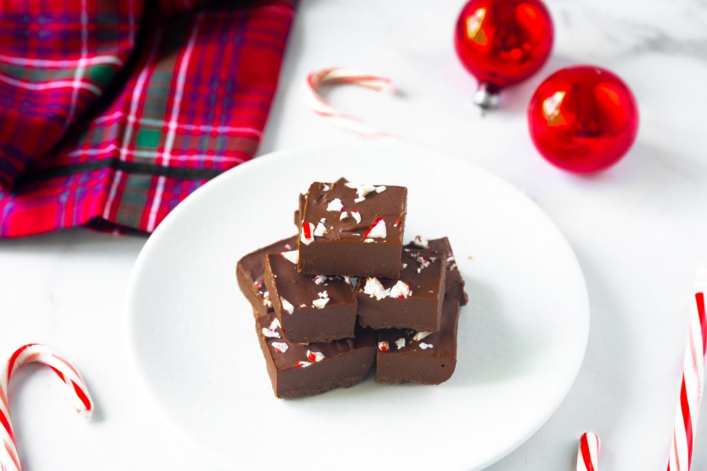 vegan peppermint fudge on serving dish with candy canes