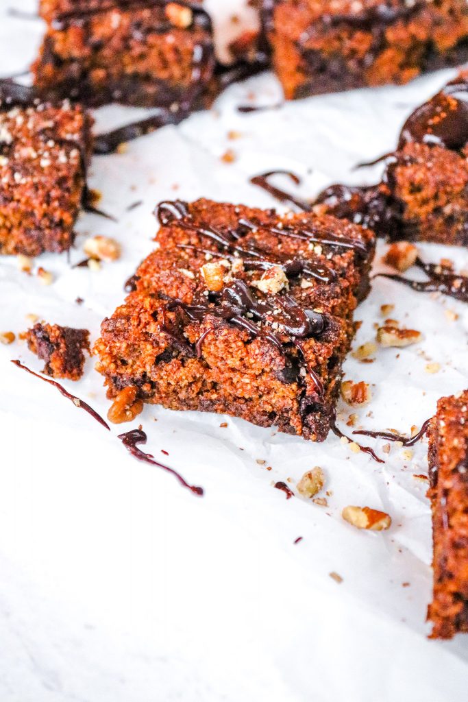 square of a keto pumpkin brownie with chocolate sauce