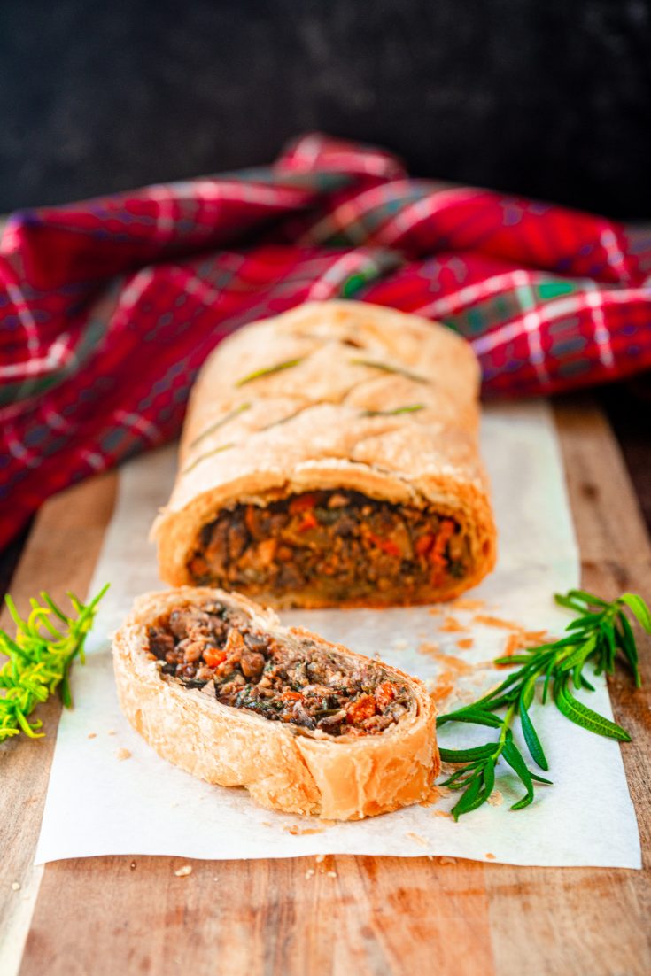 vegan wellington cut into slices with rosemary