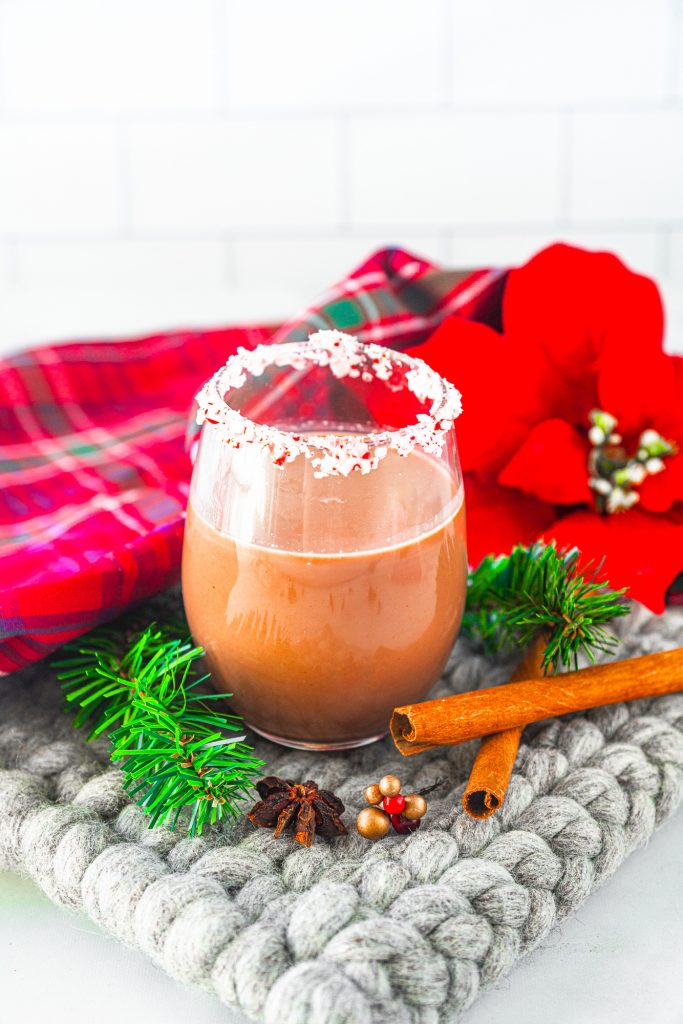 chocolate peppermint martini in serving glass with christmas decorations