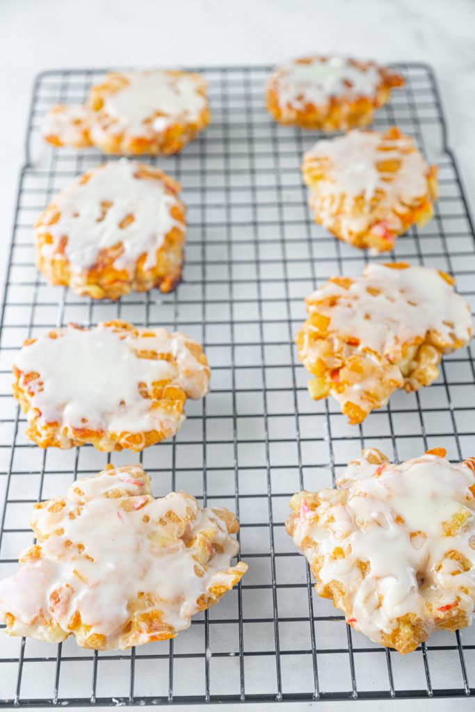 big batch of healthy apple fritters on cooling rack