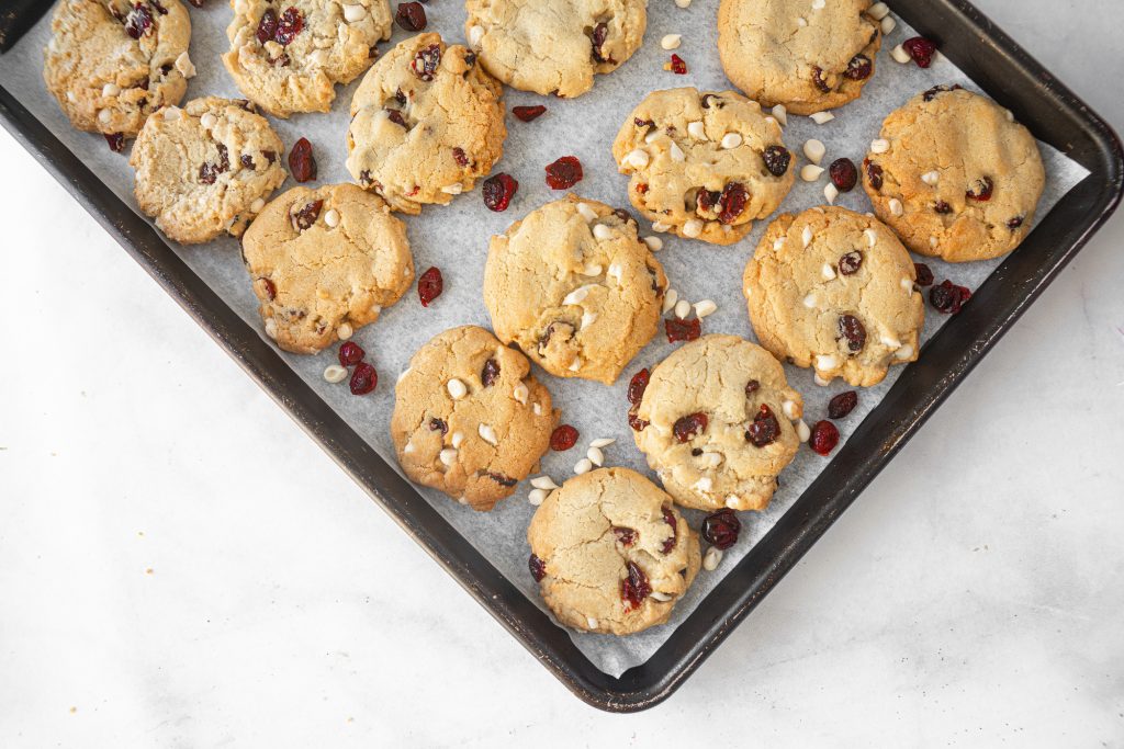 sheet of vegan cranberry cookies with white chocolate chips