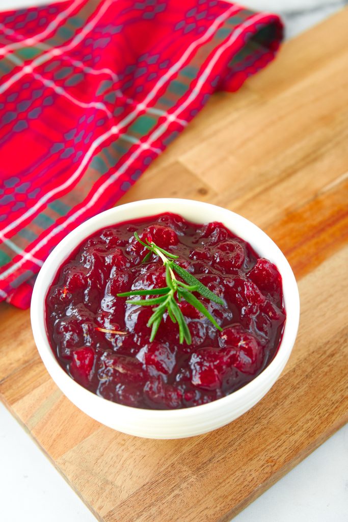 vegan cranberry sauce in bowl with red dish cloth