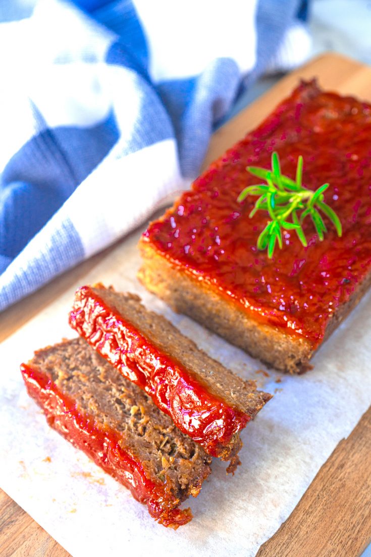 vegan meatloaf with rosemary on serving board