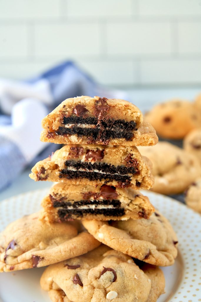 three vegan oreo stuffed cookies cut open