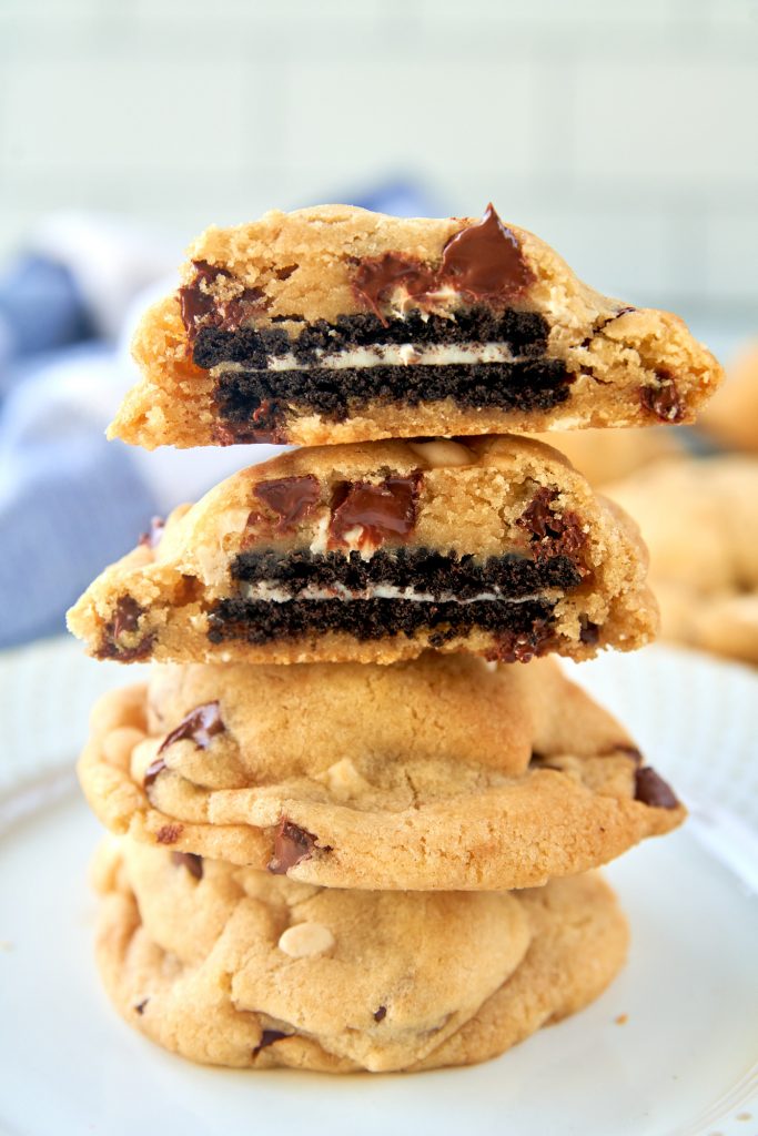 four vegan Oreo stuffed cookies cut in half on a plate