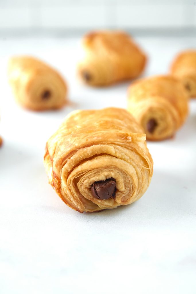 close up of a vegan chocolate croissant made with puff pastry dough