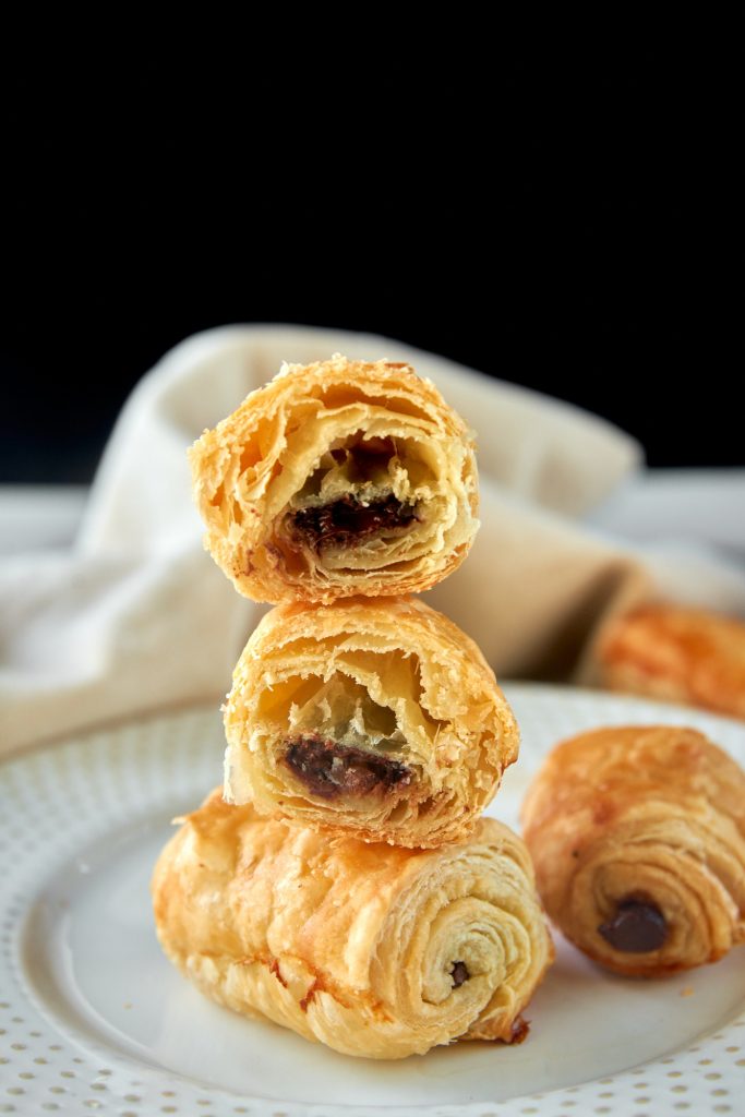 vegan pain au chocolat cut in half so you can see the chocolate inside