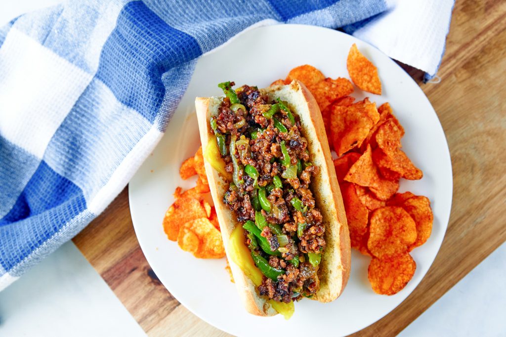 vegan philly cheesesteak from above with BBQ potato chips