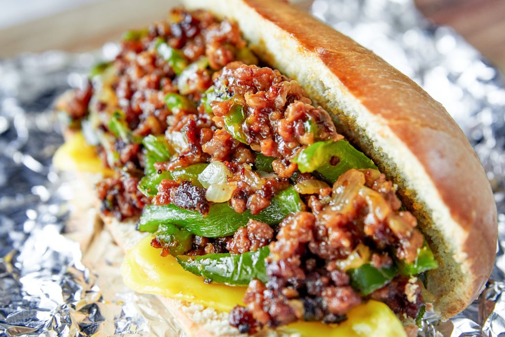 vegan philly cheesesteak with vegan fake meat and green peppers