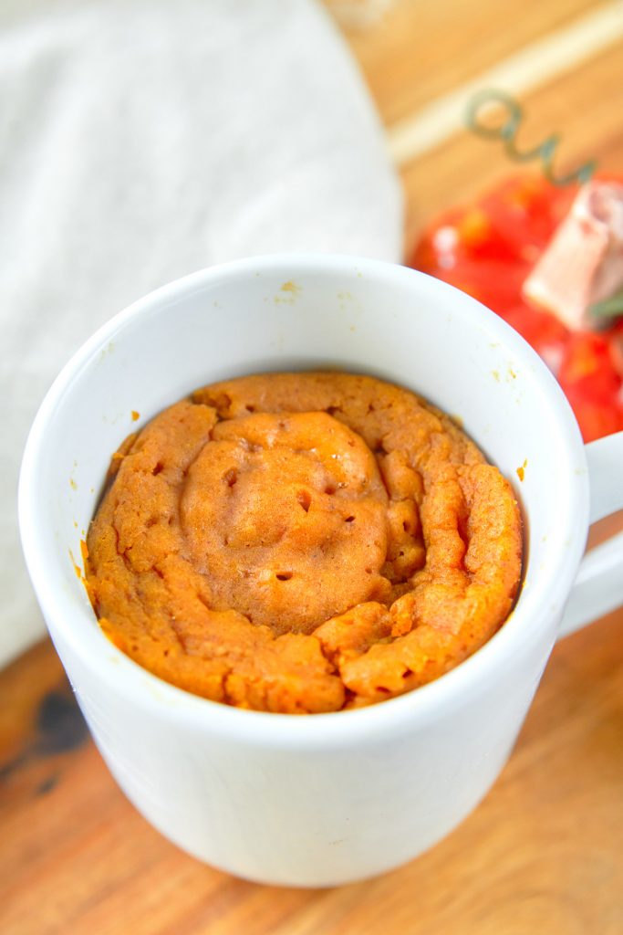 cooked vegan pumpkin mug cake on counter