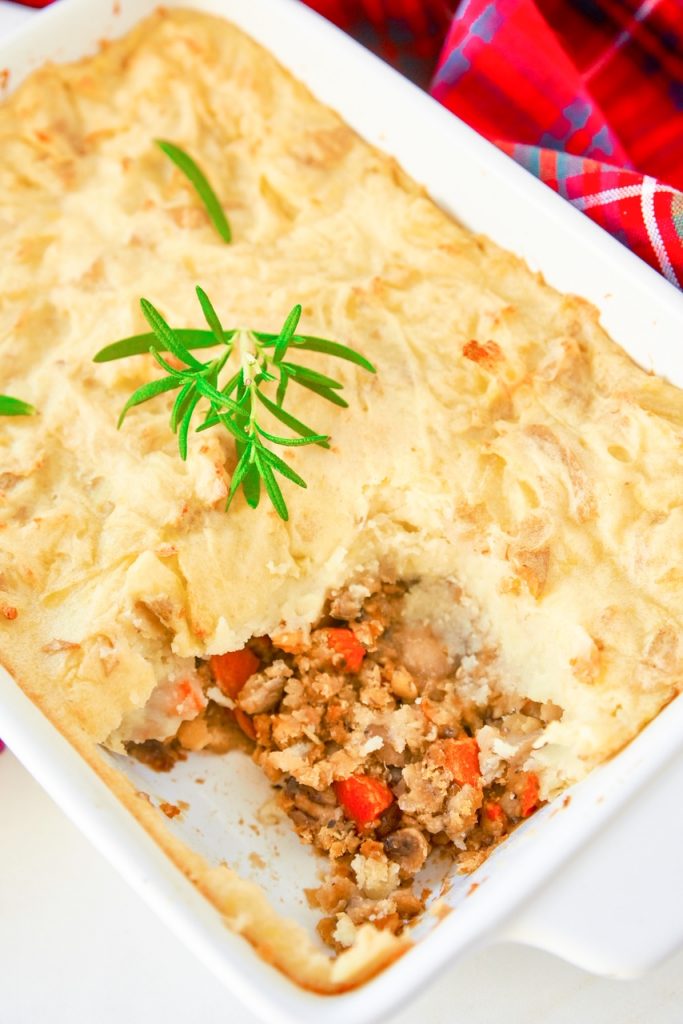 Looking into a vegan shepherd's pie in a casserole dish.