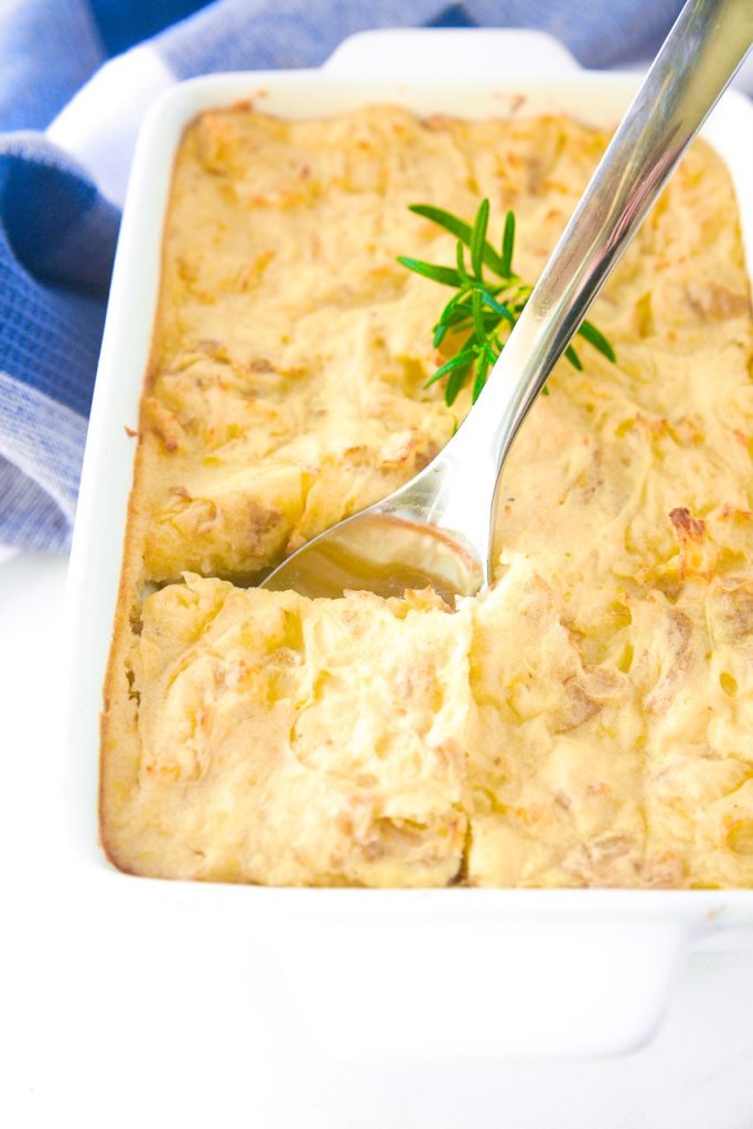 vegan shepherd's pie being scooped out of casserole dish