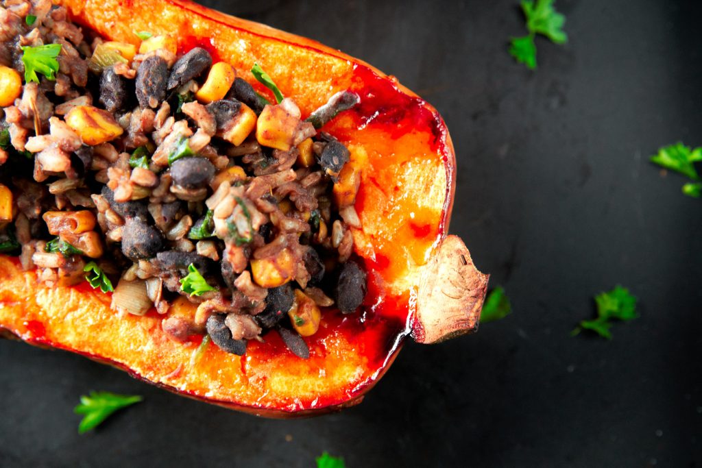 close up of roasted and stuffed vegan butternut squash