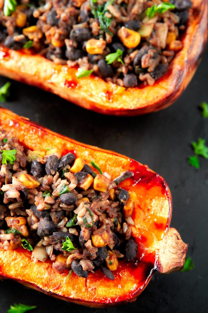 close up of the side of a stuffed butternut squash that is vegan