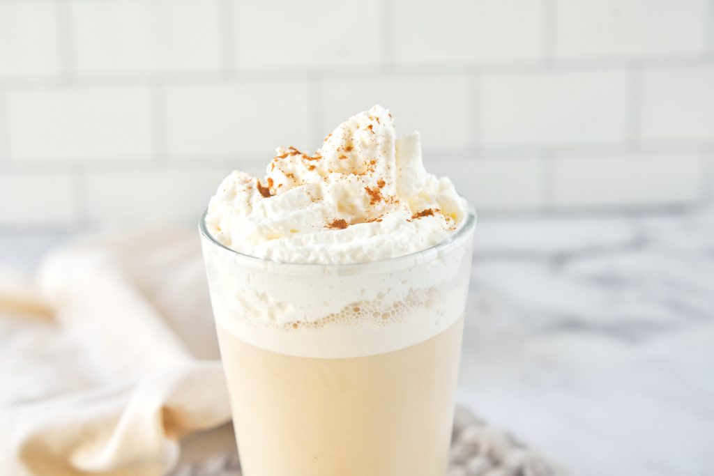 close up of the top of a tall chai frappuccino that is vegan