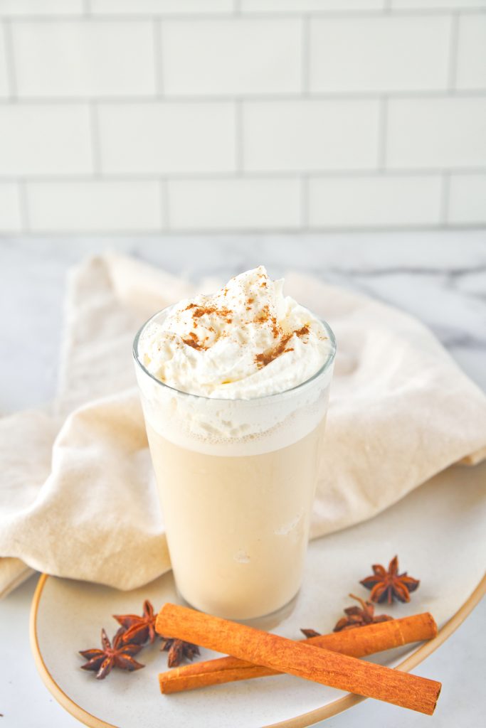 vegan copycat chai frappuccino on a plate with cinnamon and cloves