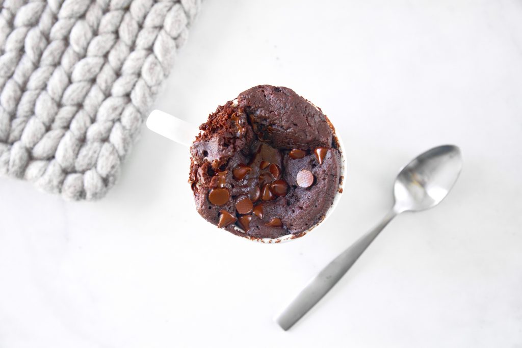  above view of a chocolate vegan mug cake topped with chocolate chips