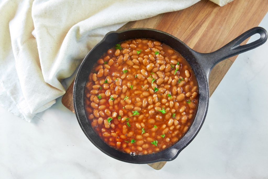 easy vegan baked beans in a cast iron skillet