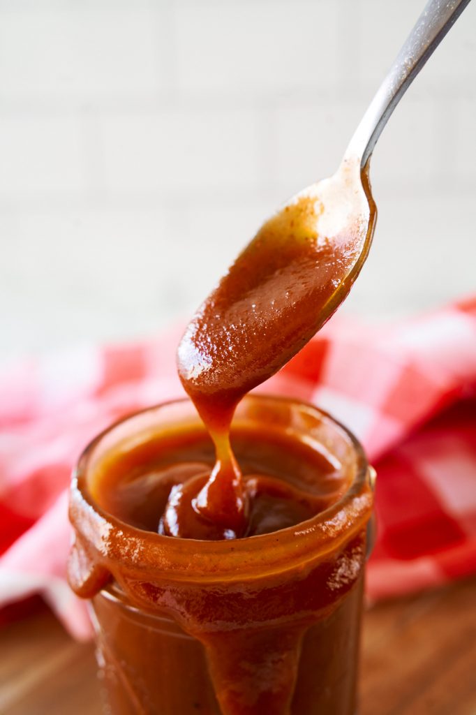 close up of vegan barbecue sauce in a spoon