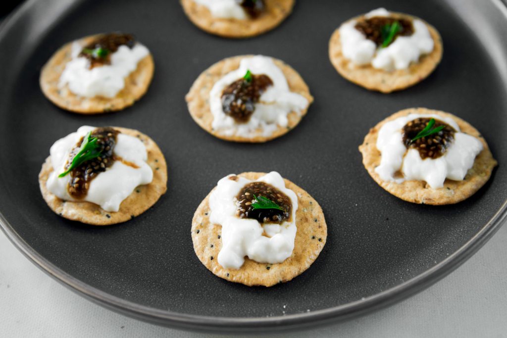 multiple crackers with vegan caviar on it