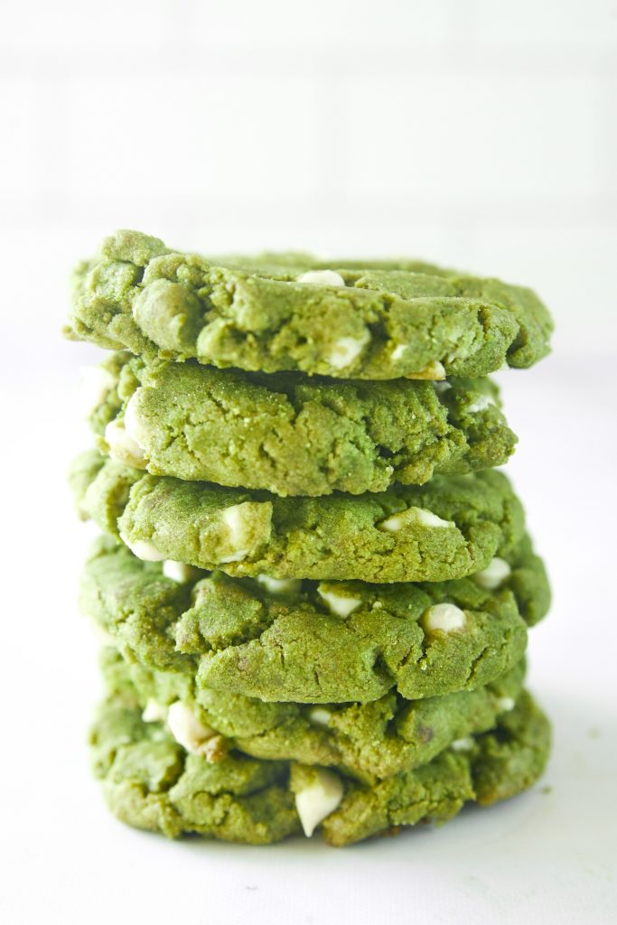 stack of vegan matcha cookies with white chocolate chips