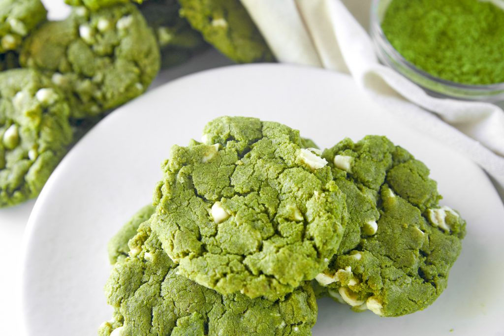 pile of matcha white chocolate cookies on serving tray