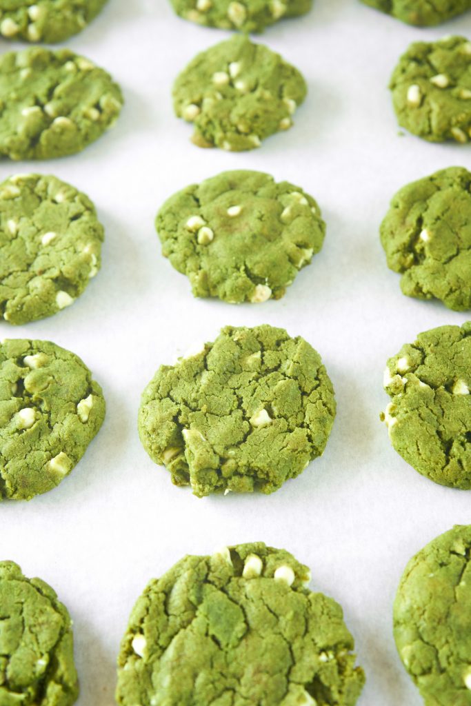 lots of vegan matcha cookies cooling on tray