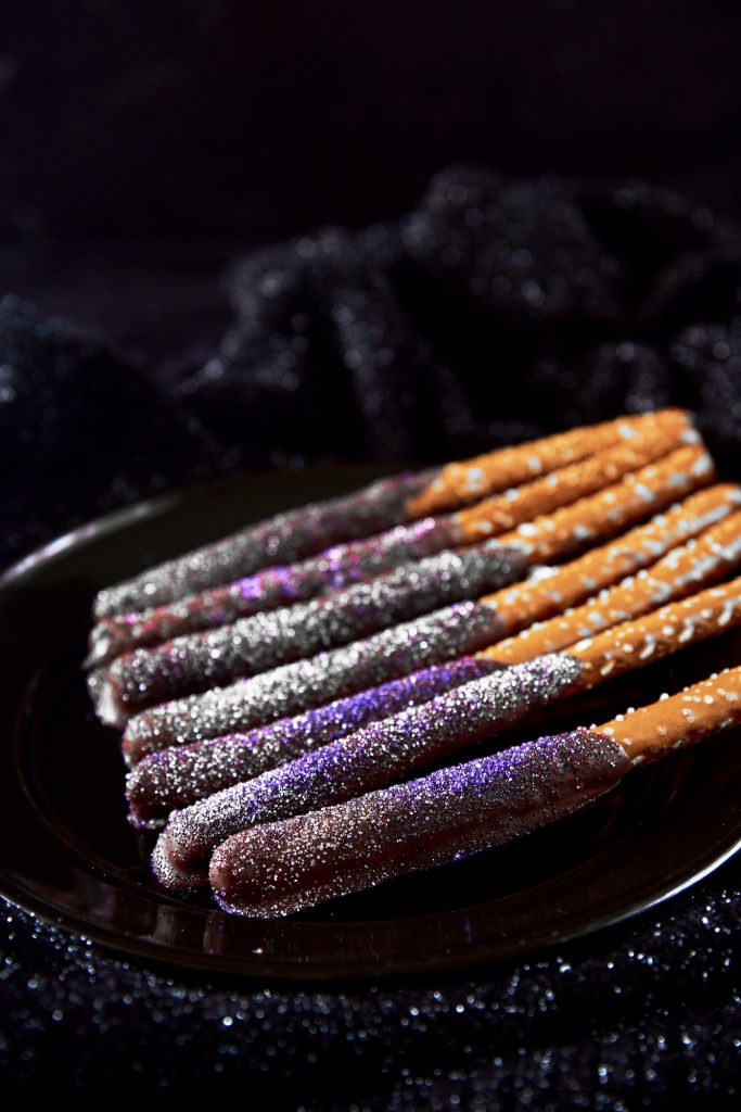 Hocus pocus halloween pretzels on a black plate