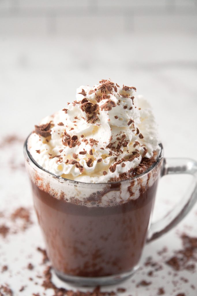 close up of vegan hot chocolate with vegan whipped cream topping