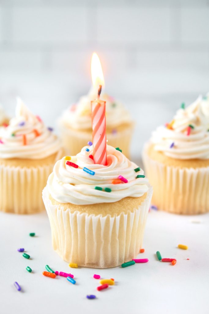 vegan vanilla cupcakes with a birthday candle in it