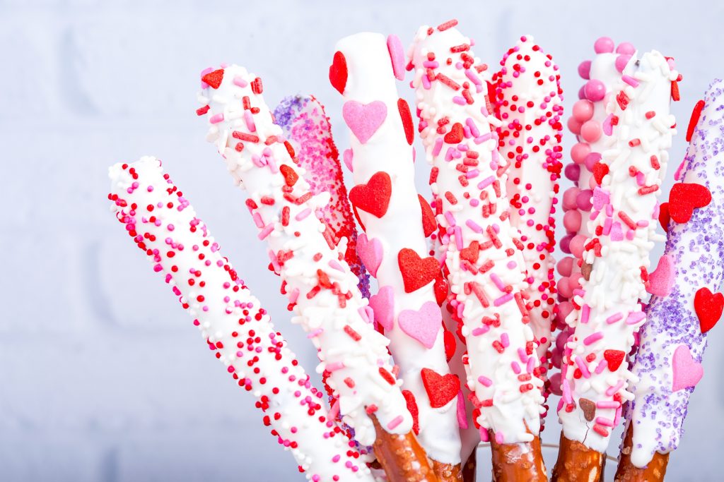 close up on valentines day pretzel rods in a jar