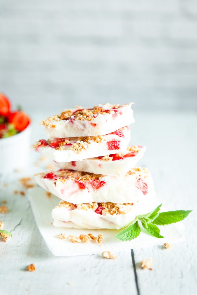 vegan frozen yogurt bark stacked with mint garnish